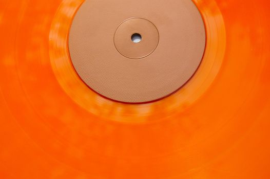 Colored orange vinyl record texture. Abstract background.