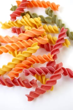 Flavors of fusilli pasta. Italian food on white background.