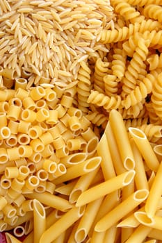 Four different kinds of italian pasta. Food background.