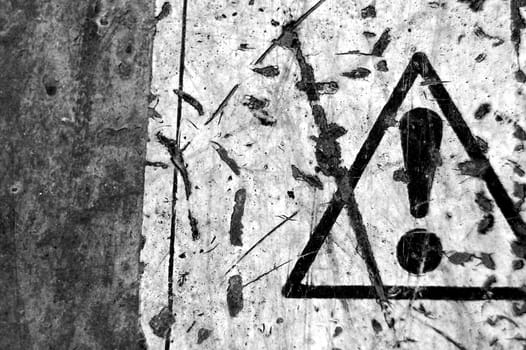 Rusty metal surface and weathered warning sign background. Black and white.