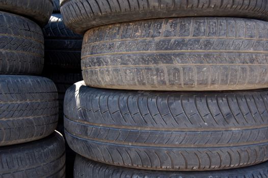 A pile of rubber car tires. Abstract background pattern.