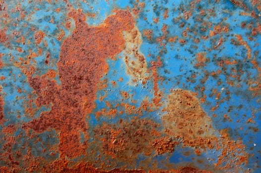 Metal texture with blue paint and rust.