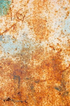Rusty metal with peeled paint and etched numbers. Abstract background texture.