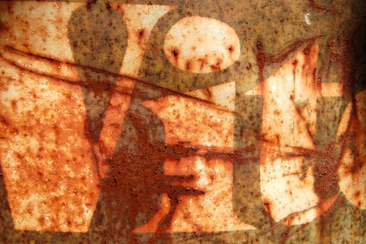 Rusty metal barrel surface with weathered type stencil detail. Abstract background texture.