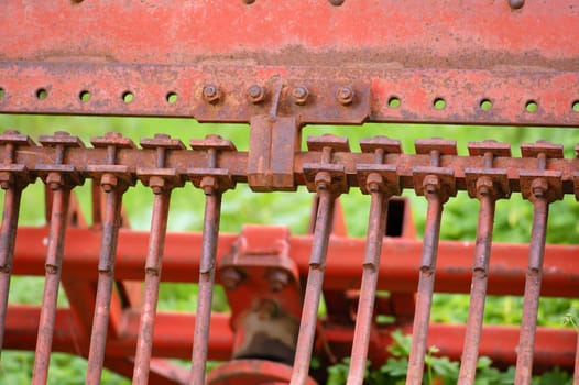 Rusty metal tillage plow detail. Abstract background.