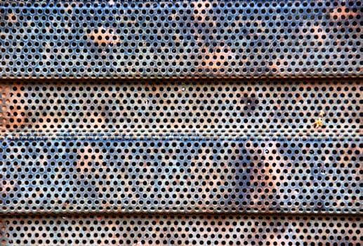 Rusty industrial radiator grill detail. Metal pattern background.