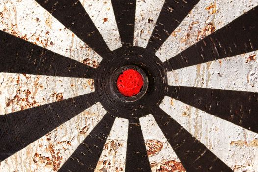 Abstract background. Old dartboard target and rusty metal texture.