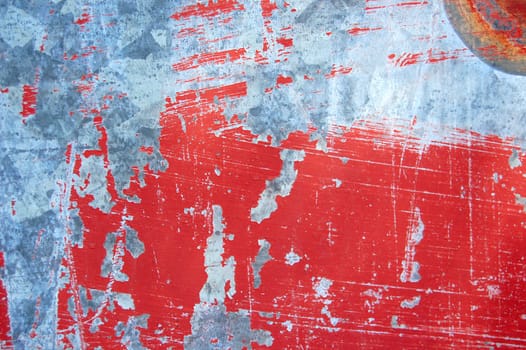 Rusty metal with red scratched paint. Abstract background texture.