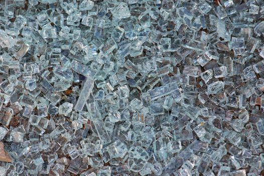 Shattered glass background texture. Pieces of smashed windscreen.