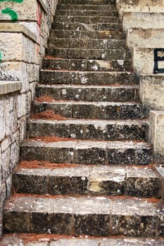 Weathered amphitheatre stone stairway. Abstract background texture.