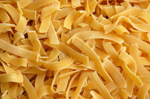 Tagliatelle pasta detail. Italian food background.