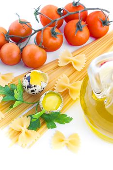 Pasta ingredients with cherry tomato, greens, eggs and olive oil