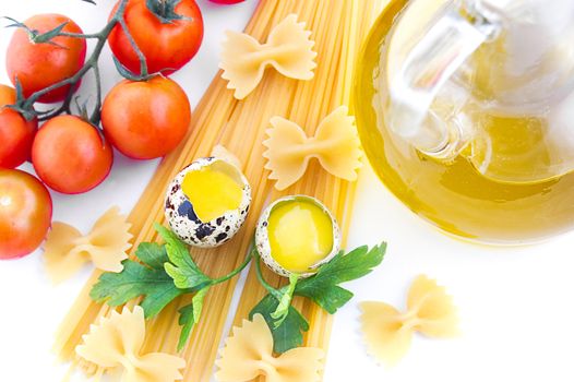 Pasta ingredients with cherry tomato, eggs, greens and olive oil
