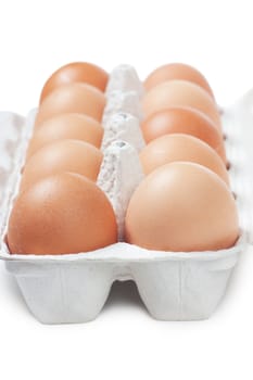 Brown eggs in carton. Nutritious eating.