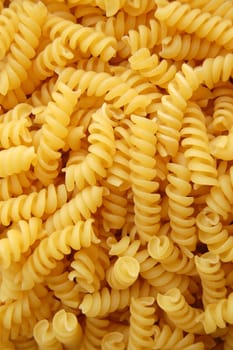 Eliche twirls pasta. Italian food background detail.