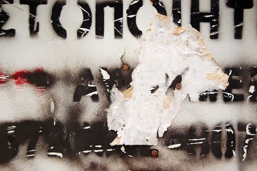 Type stencil on weathered surface. Abstract background texture.
