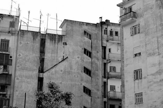 Inner city grunge apartment building. Urban background.