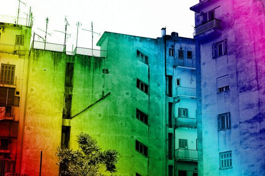Rainbow colored downtown apartment building. Urban background.