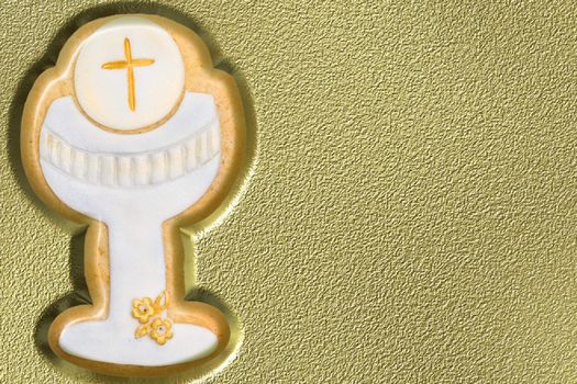 first communion chalice on gold background 
