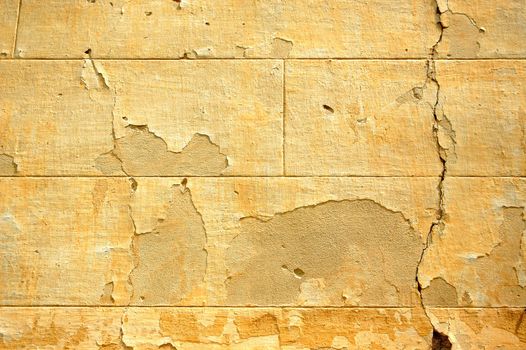 Abandoned late 19th century building ruins. Weathered wall detail.