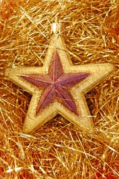 Christmas tree decoration. Golden star ornament background.