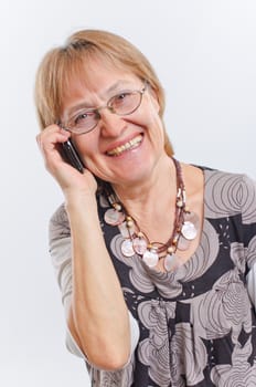 Portrait of a happy aged woman talking on the phone
