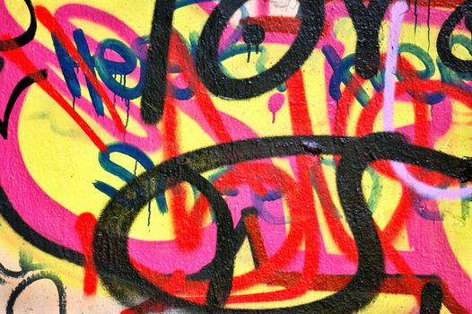 Surface covered with graffiti tags. Abstract background.