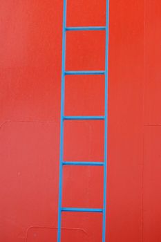 Blue metal ladder on a ferry boat. Abstract geometric background.