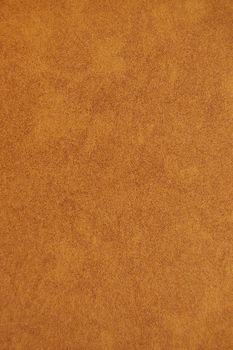 Brown recycled speckled cardboard paper detail. Background texture.