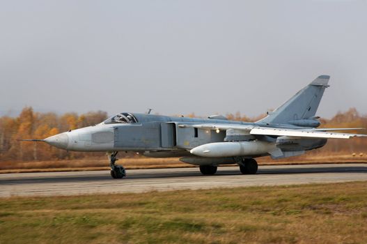 Military jet bomber airplane Su-24 Fencer on take off and landing