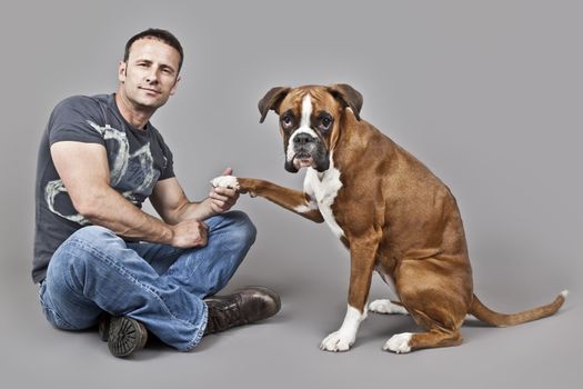 An image of a handsome muscle man with his dog
