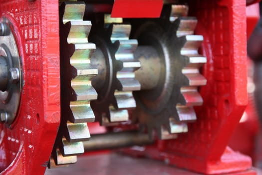 A large chain drive on a seed separator machine.