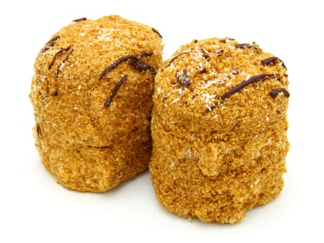 Honey cake with chocolate on a white background