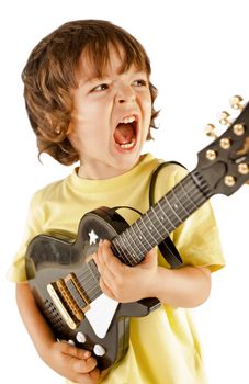 Little boy playing a guitar screaming, isolated on white background
