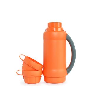 Open modern orange thermos standing near mugs on white background. Isolated with clipping path