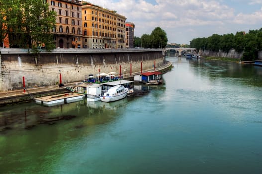 Houseboats and boats on the Tiber in Rome