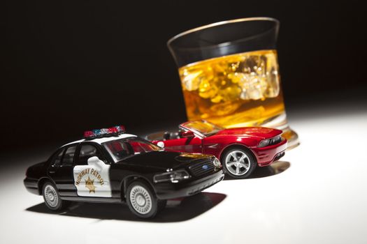 Police and Sports Car Next to Alcoholic Drink Under Spot Light.