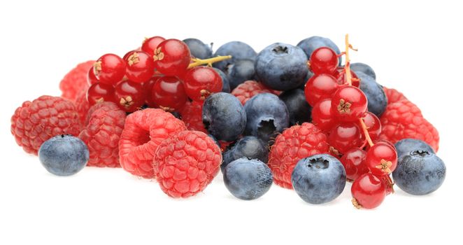 Image of a heap of various berry fruits photographed in a studio against a white background.