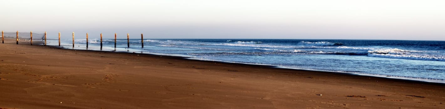 sunset at Ormond Beach with beautiful sky and blue water