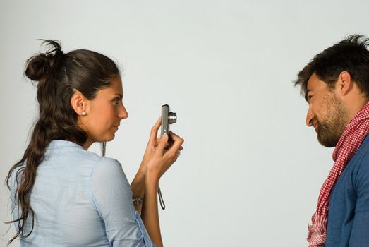 Happy loving couple having fun taking photos of themselves