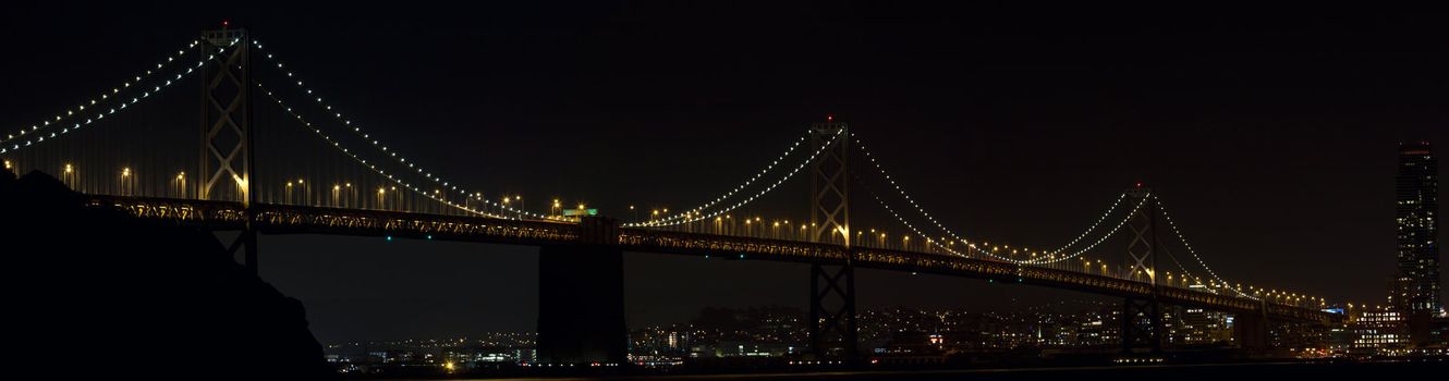 Oakland Bay Bridge Over San Francisco Bay in California at Night Panorama