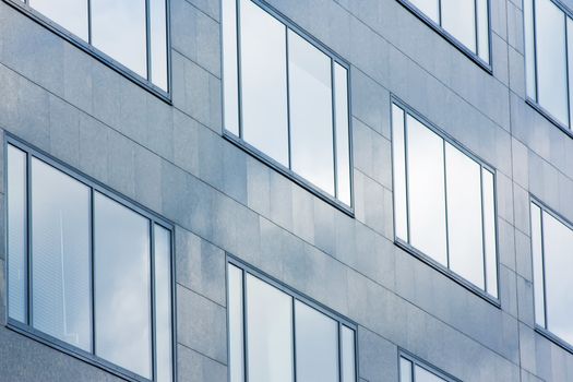 Facade of office building in blue atmosphere