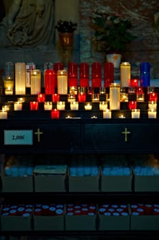 Burning Candles Before The Altar In The Church