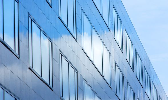 Facade of office building in blue atmosphere