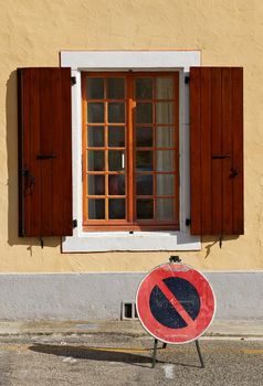 Traffic Sign Prohibiting Stopping near an Open Window in the Town of Saou, France