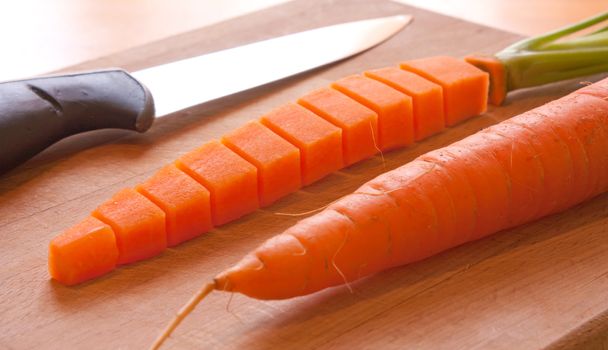 Carrot cut and re-form, knife and plank