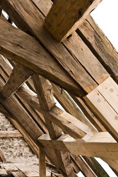 wooden framework on ancient roof with old and new wood