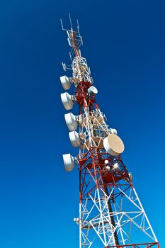 Communications tower with a beautiful blue sky