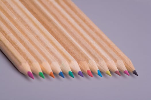 A composition of pencils of wood in a variety of colors