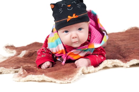 Shot of little cute baby in lying on fur